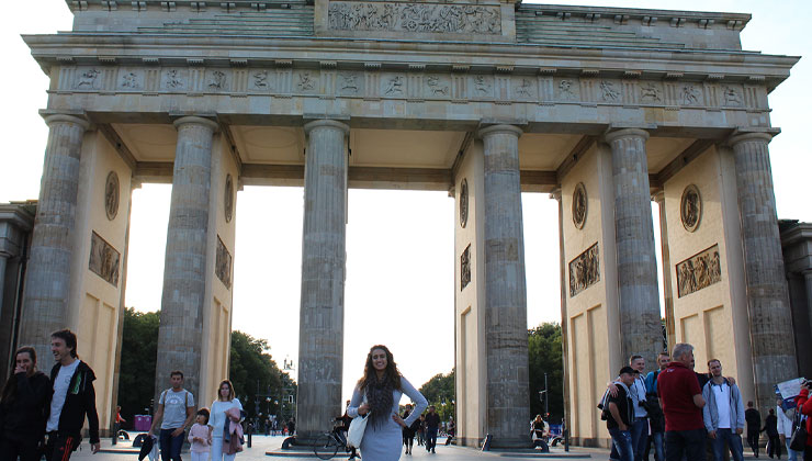UC Santa Cruz student standing in front of the Brandenburg Gate in Berlin, Germany.